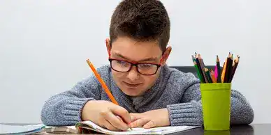 boy writing for UCS 7 Plus
